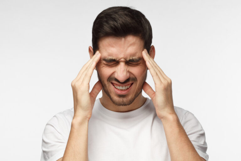 man suffering from a headache