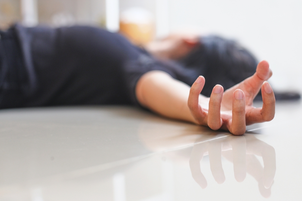 Close-up of hand with epileptic seizures at home, girl injure at home.