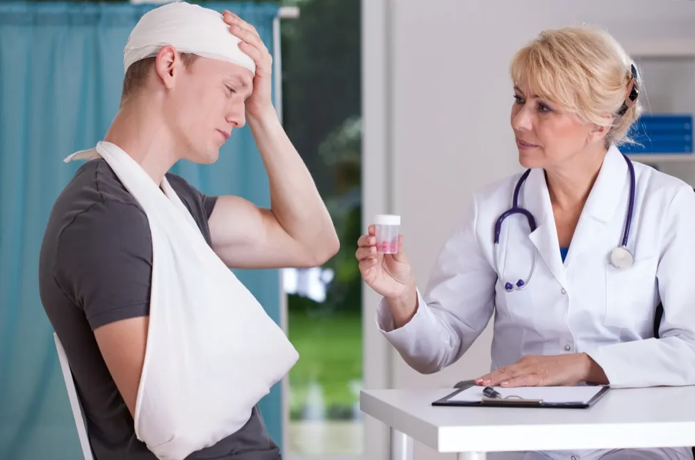 physician giving to patient pills for headache