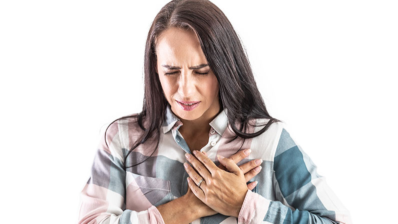 A woman experiencing chest pain.