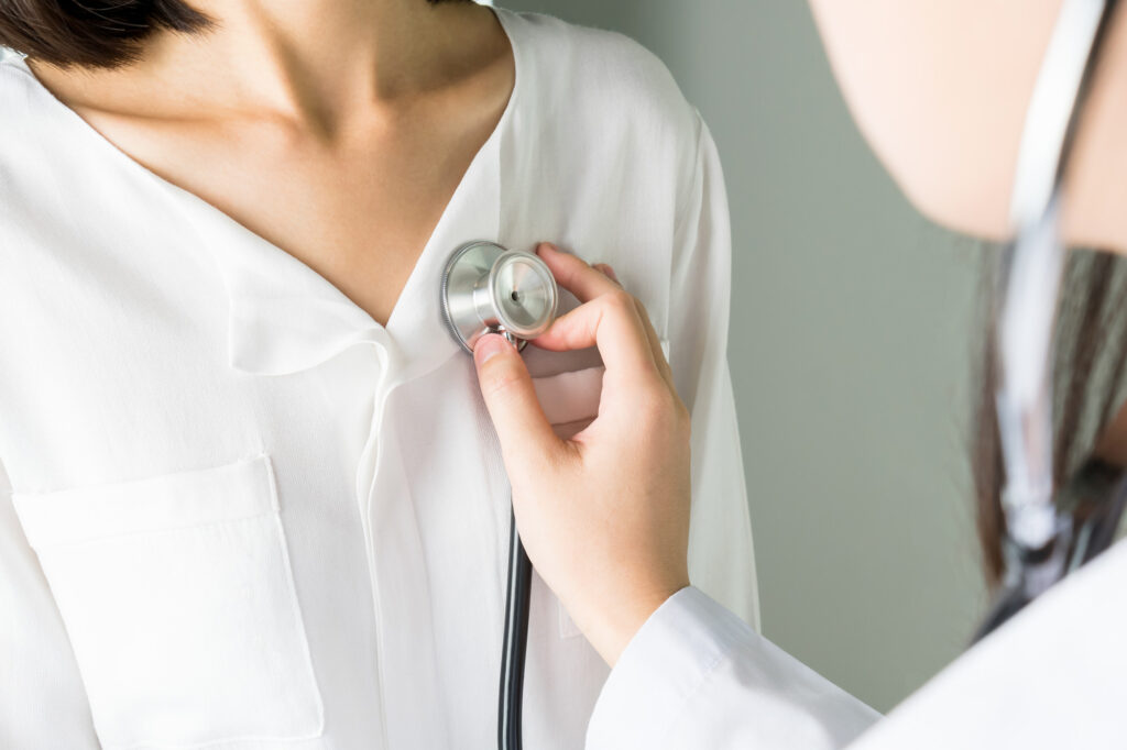 Doctor is using a stethoscope for patient examination.