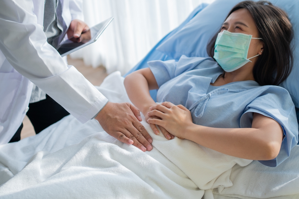 Group Of Doctor Try To Help Patient Woman Lie On